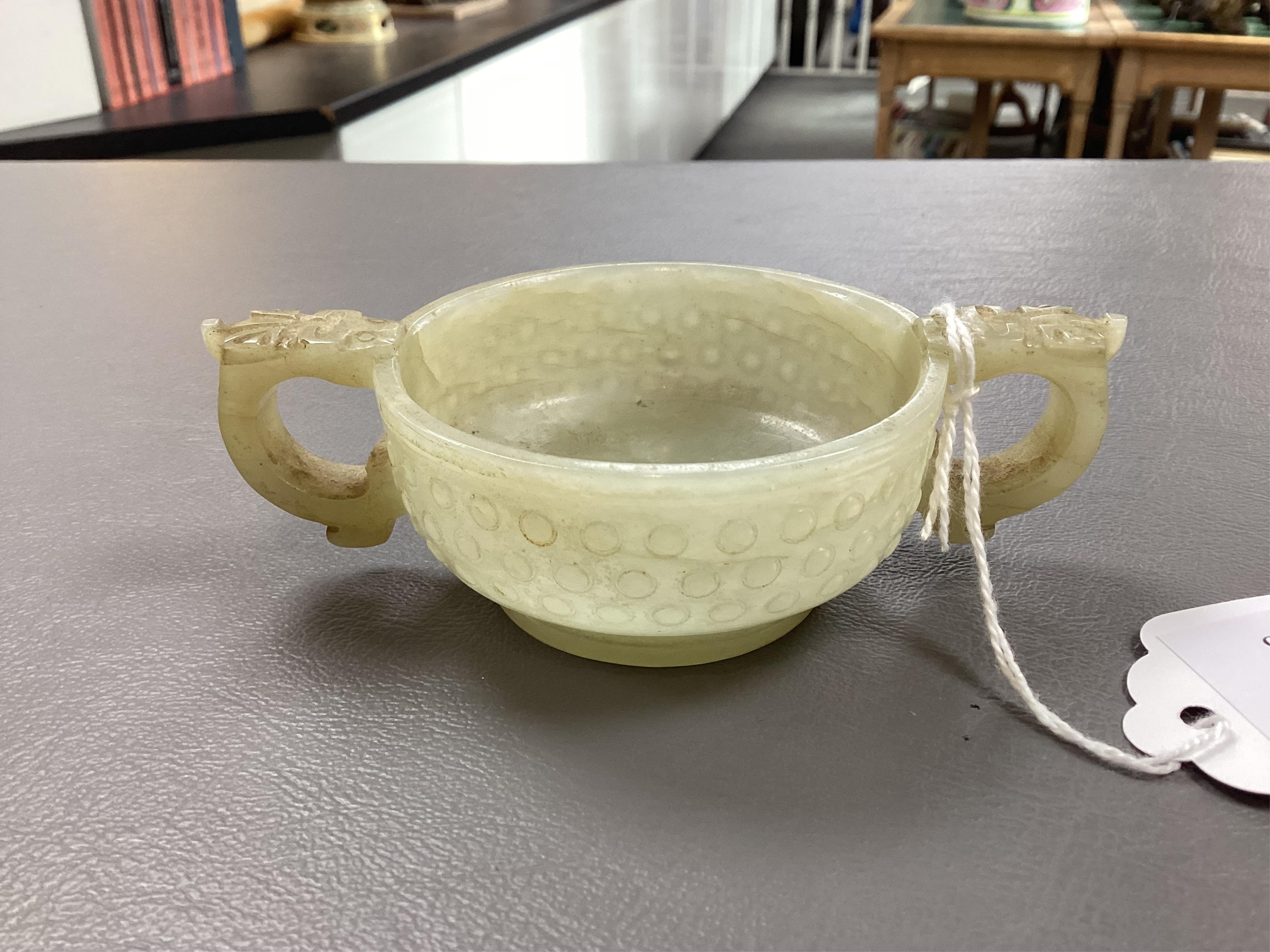 A Chinese pale celadon and russet veined jade cup, 17th century